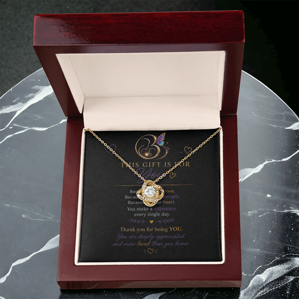 18K yellow gold Eternal Hope Necklace displayed inside an open premium gift box